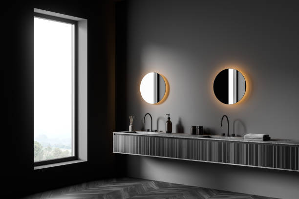 istock Dark bathroom interior with sinks and mirror, parquet floor and window 1366562880