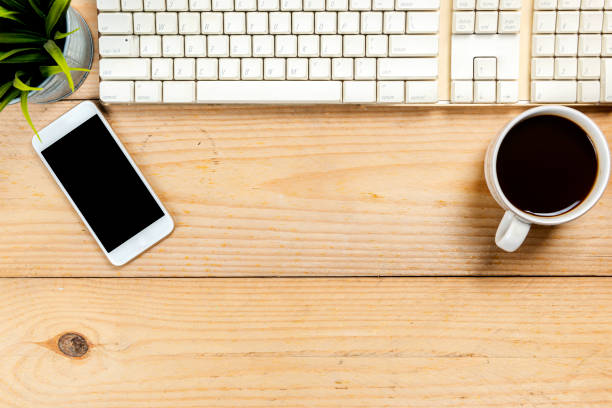 istock Computer keyboard with mobile phone and cup of coffee 1366564088