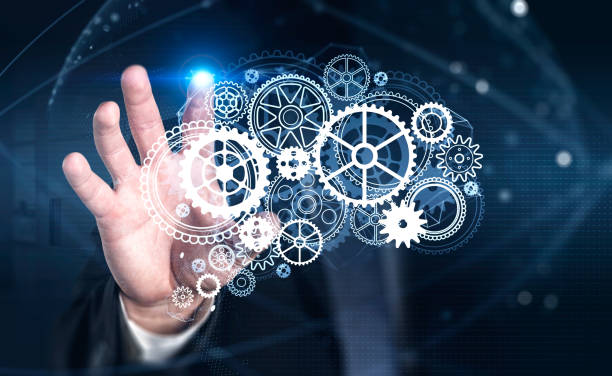 istock Businessman wearing formal suit is touching screen of digital interface 1366565017