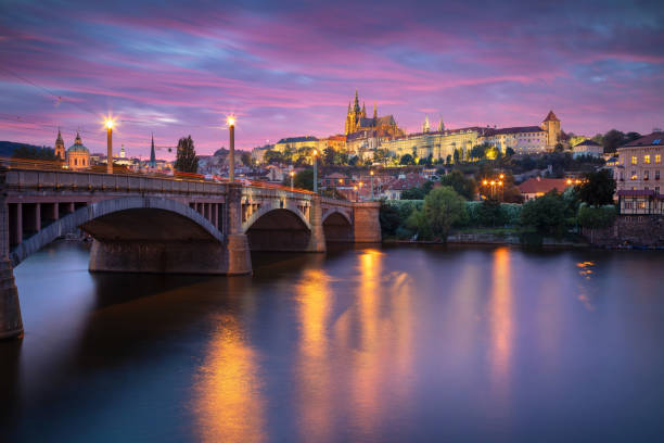 Prague, Czech Republic. Cityscape image of Prague, capital city of Czech Republic with St. Vitus Cathedral and the Charles Bridge over Vltava River at sunset. vltava river stock pictures, royalty-free photos & images