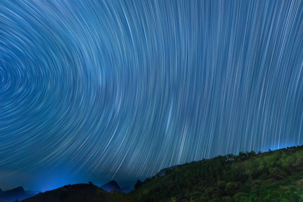 istock fine star trail in blue sky 1366568758