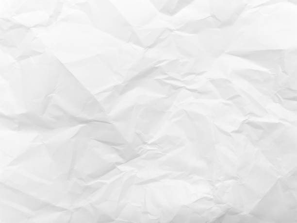 istock Background texture of white crumpled paper. Space for copying. 1366570294