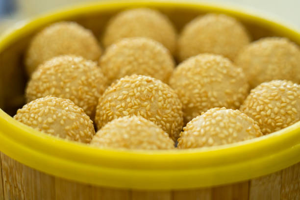Close up on the top of a burger bun with sesame seeds