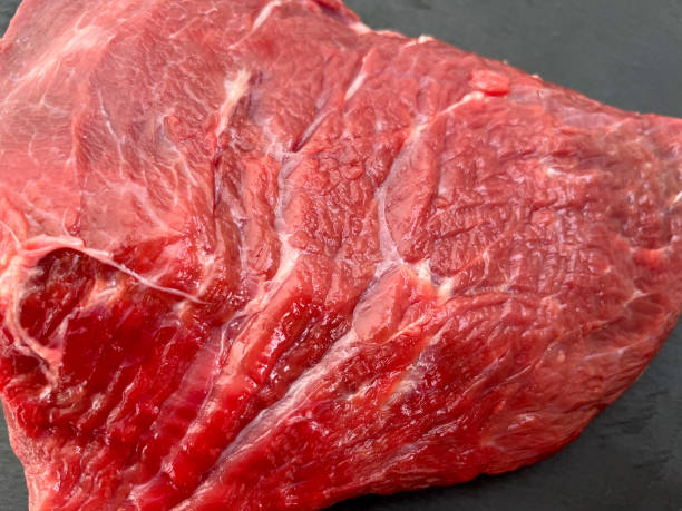 istock Delicious raw piece of red beef hip part 1366571347