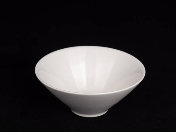 Ceramic Conical Shaped Bowl on Black Background stock photo