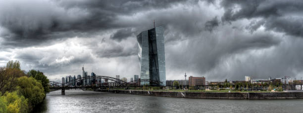 EZB Panoramic view of the ECB (European Central Bank) in Frankfurt am Main with the river Main in the foreground during stormy thunderstorms and dramatic cloudy skies

(All logos and legal identifiers are removed as you requestet) Microburst stock pictures, royalty-free photos & images