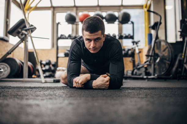 istock Fit man exercising in gym 1366575435