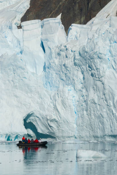 istock Tourists observing a glacier on the Antarctica, 1366576615