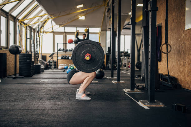 istock Woman exercising with weights 1366578353