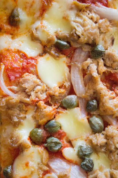 istock homemade pizza with tomato, mozzarella, capers and onions 1366579286