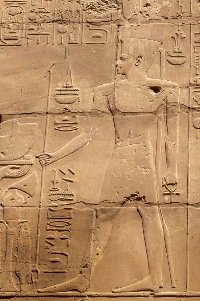 istock Ancient stone carved Egyptian hieroglyphics in Karnak temple, Luxor, Egypt 1366580883