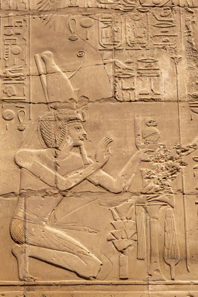 istock Massive columns inside beautiful Egyptian landmark with hieroglyphics, and ancient symbols in Karnak temple, Luxor, Egypt 1366580904
