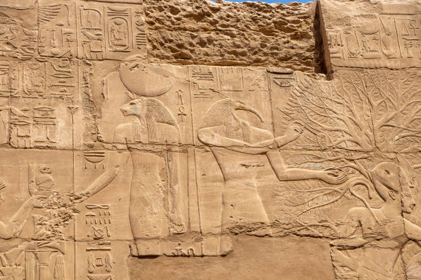istock Massive columns inside beautiful Egyptian landmark with hieroglyphics, and ancient symbols in Karnak temple, Luxor, Egypt 1366580924