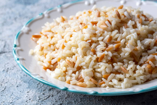 Traditional delicious Turkish food; Turkish style rice pilaf (Turkish name; Arpa sehriyeli pirinc pilavi) Traditional delicious Turkish food; Turkish style rice pilaf (Turkish name; Arpa sehriyeli pirinc pilavi) pilau rice stock pictures, royalty-free photos & images