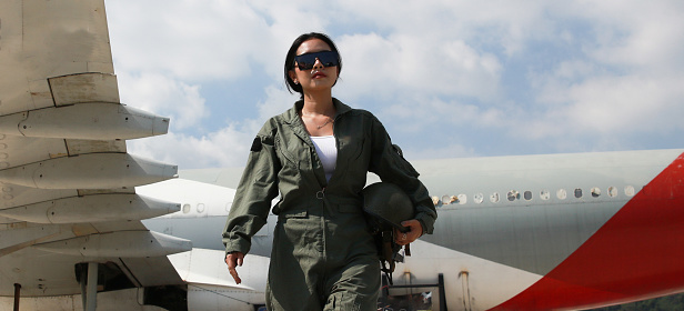 Smart Female soldier walk at front of air plain