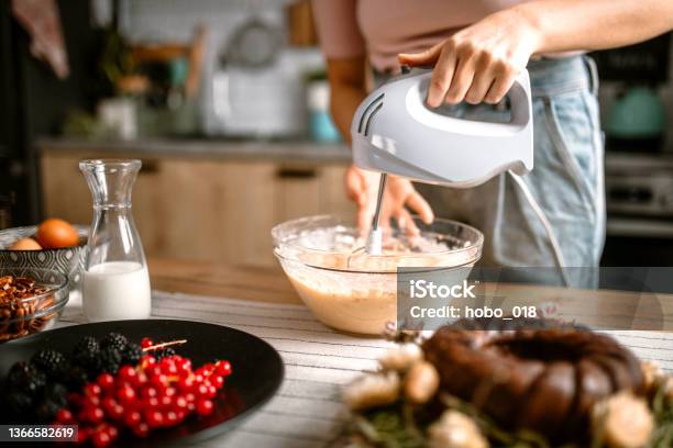 Mixing Cake Batter With Electric Mixer In The Kitchen Stock Photo - Download Image Now