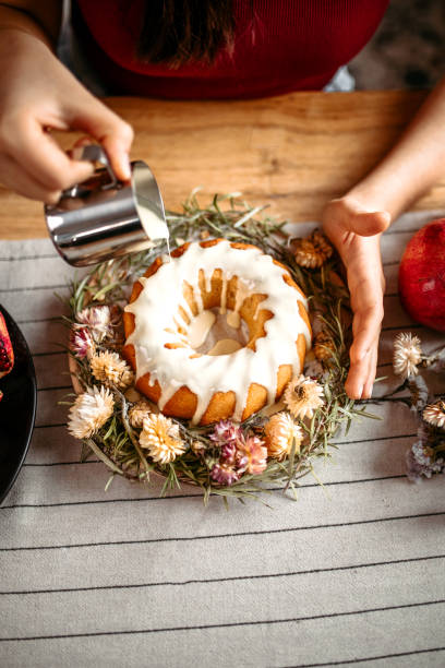 istock Finishes cake with melted white chocolate 1366583696
