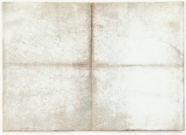 istock Close-up of aged paper, isolated on white 1366583771
