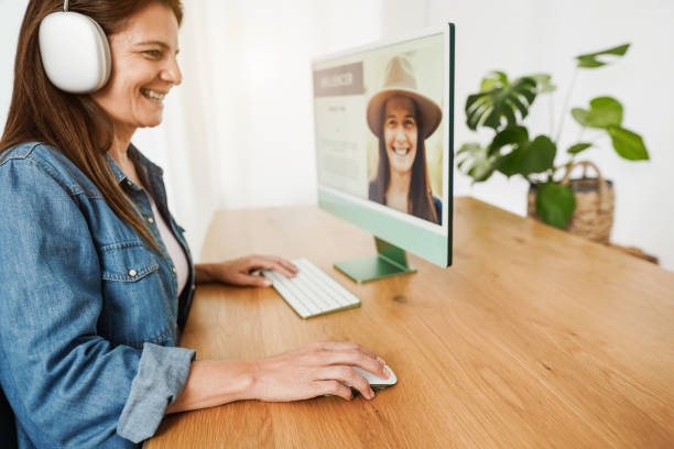 istock Influencer woman doing podcast using computer at home - Focus on right hand 1366583943