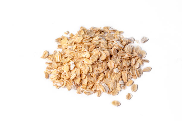 istock Heap of dry rolled oats isolated 1366584980