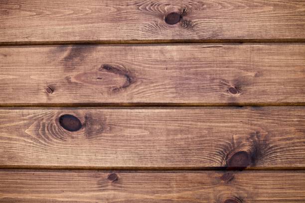 istock Unpainted natural hardwood boards texture close-up 1366585219