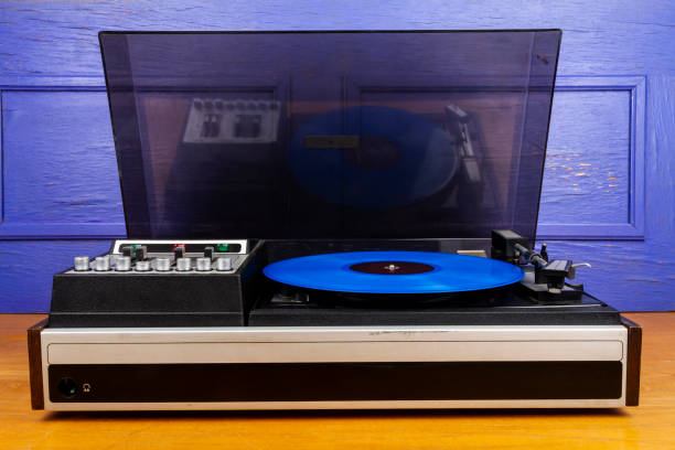 istock Vintage turntable vinyl record player with blue vinyl 1366586717