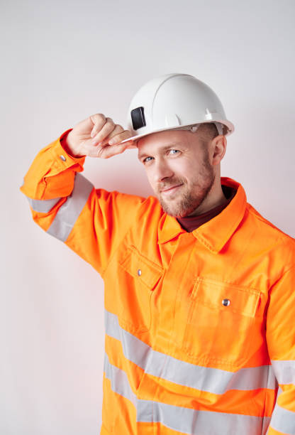 istock Construction worker portrait in orange vest and hard hat 1366588062