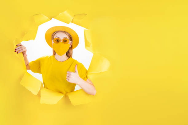 istock Hipster girl in stylish monochrome protective mask 1366588149