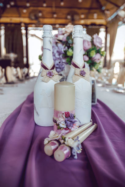 istock decorated candles and champagne on the wedding table 1366588591