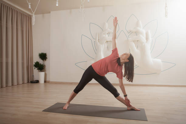 istock Young woman practicing yoga 1366593668