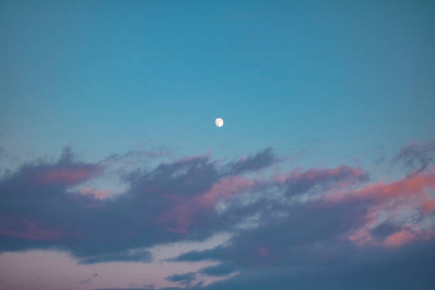 istock Photo of the moon during sunset 1366593880
