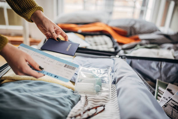 istock Woman packing things in the suitcases 1366593883