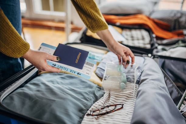 istock Woman packing things in the suitcases 1366594452