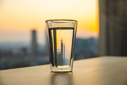 A glass of water on table in the morning