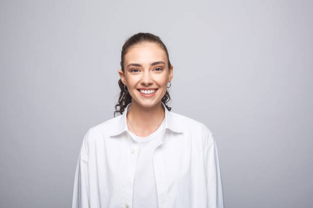 Cheerful young woman in white shirt
