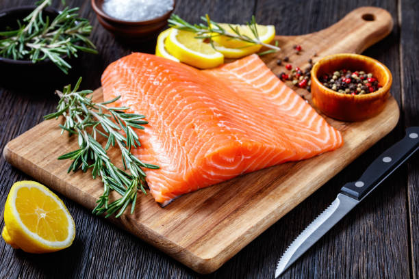 istock Fresh salmon fish fillet on wooden board 1366595449