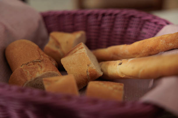 istock purple vimini bowl filled with bread slices and breadsticks, focus on the foreground 1366596814