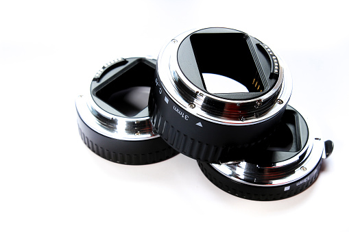 Black Extension tubes for macro photography on white background.