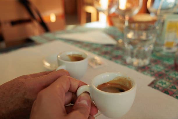 istock making a toast with coffee cups. blurred bar interiors background 1366597346
