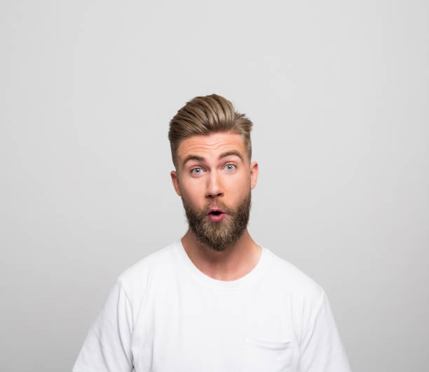 istock Headshot of surprised young man 1366598002