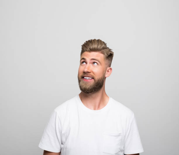 istock Headshot of surprised young man 1366598061