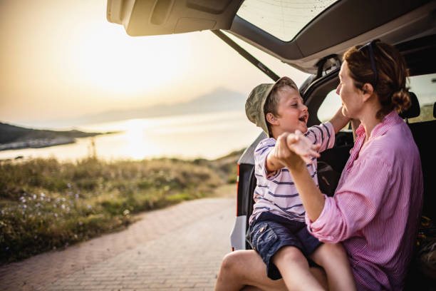 istock Mother and boy on the road trip 1366598568