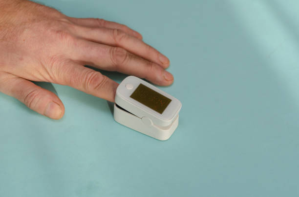 istock A man's hand with an oximeter on his index finger. 1366599792