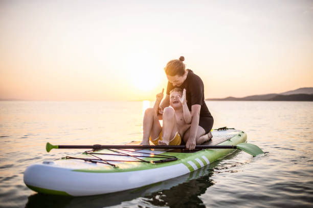 istock Mother and son on a paddle board 1366600191