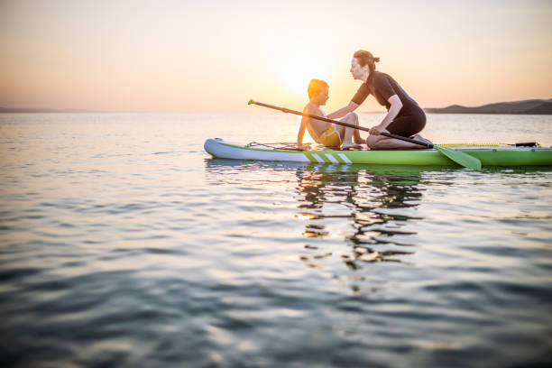 istock Mother and son on a paddle board 1366600214