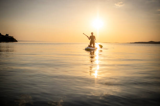istock Young woman on a paddle board 1366600229