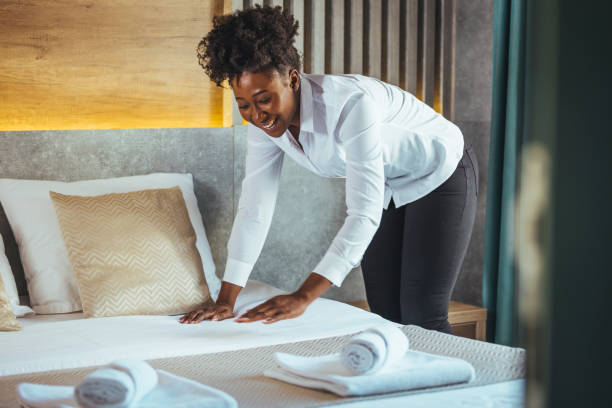 istock Maid working making the bed at a hotel. 1366601586
