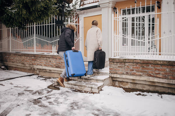 istock Young couple coming home from winter vacation 1366601776