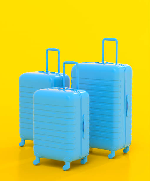 istock Colorful suitcase on yellow background. 3D render of summer vacation concept 1366601823