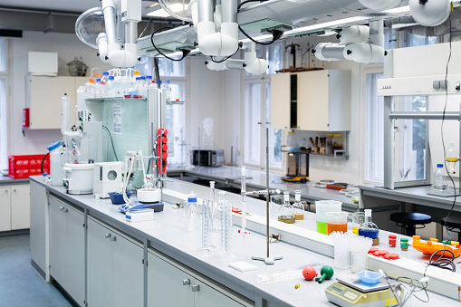 Laboratory room interior in modern research institute. Chemistry laboratory interior with scientific experiment equipment.